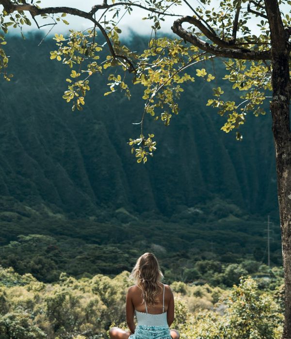 Woman in a calm yoga pose, breathing deeply.